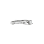 This white gold ring displayed in side view is made with a princess solitaire diamond set in four-prong setting