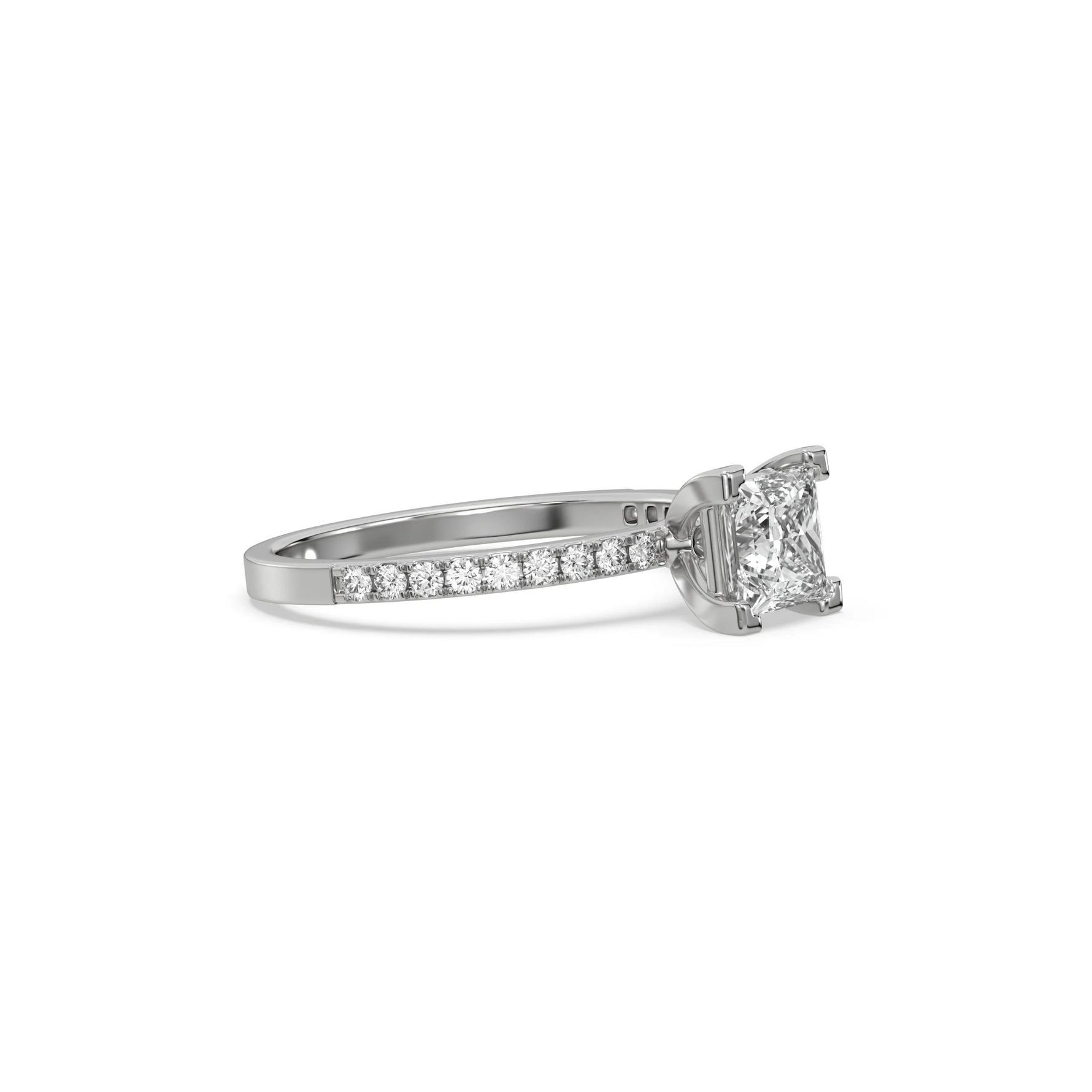 This white gold ring displayed in side view is made with a princess solitaire diamond set in four-prong setting