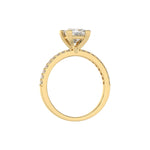 This yellow gold ring displayed in through finger view is made with a princess solitaire diamond set in four-prong setting