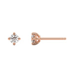 This rose gold pair feature a classic round solitaire diamond in a four prong setting in top view and side view