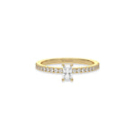 This yellow gold ring displayed in front view is made with a radiant solitaire diamond set in four-prong setting