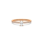 This rose gold ring displayed in front view is made with a radiant solitaire diamond set in four-prong setting