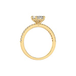 This yellow gold ring displayed in through finger view is made with a radiant solitaire diamond set in four-prong setting