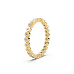 This yellow gold Full Eternity ring features round diamonds set in bezel setting in side view