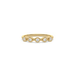 This yellow gold ring displayed on front view is made with brilliant round diamond set in bezel setting