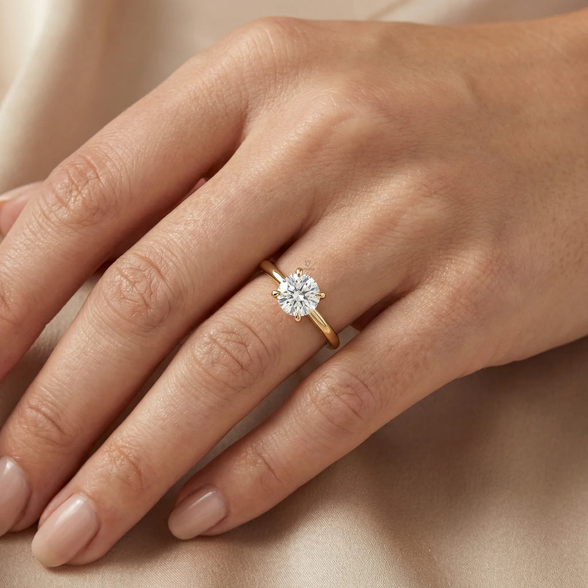 An elegant 14k gold diamond ring showcasing a sparkling round solitaire stone set on a slim polished band, with engagement ring 