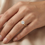 An elegant 14k gold diamond ring showcasing a sparkling round solitaire stone set on a slim polished band, with engagement ring 