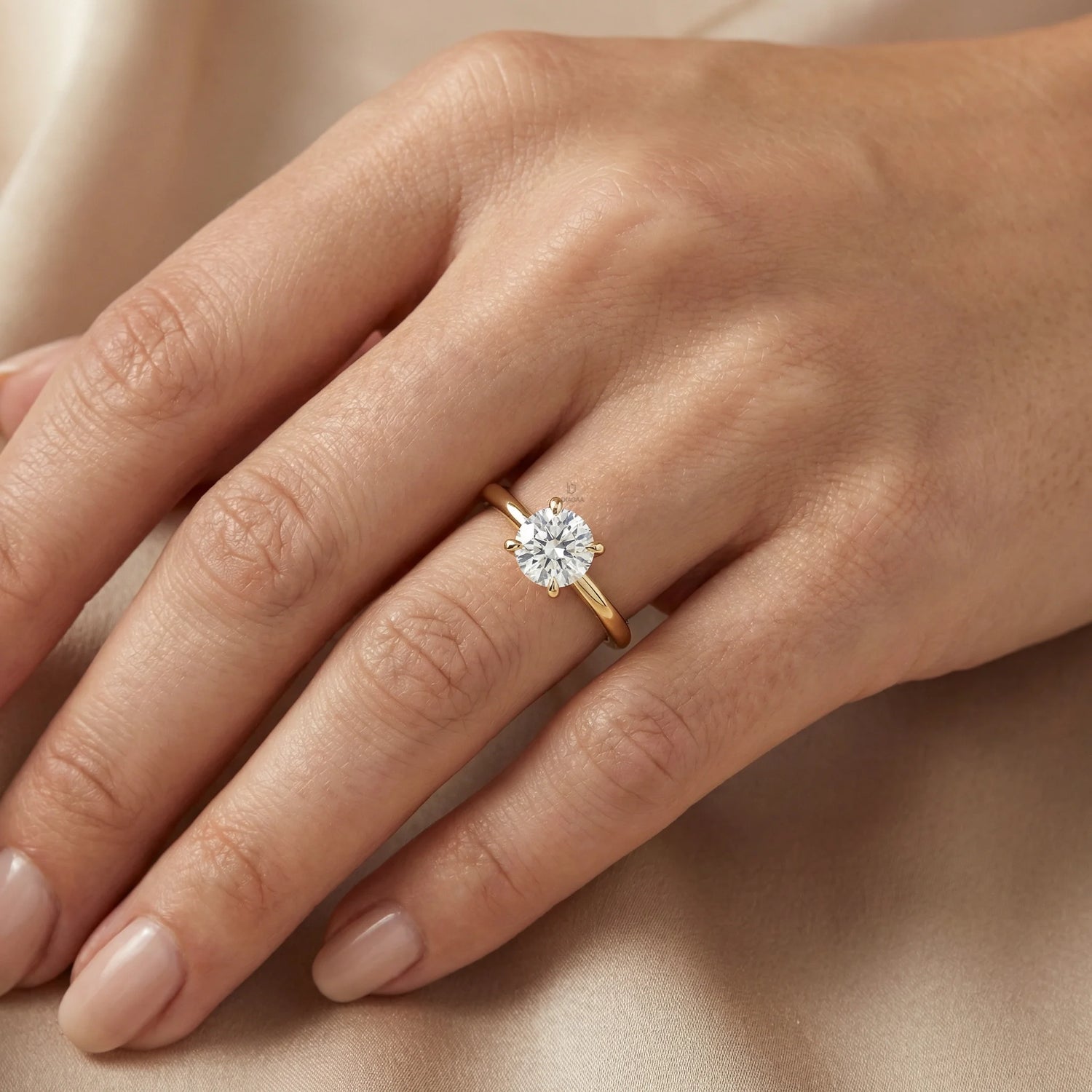 An elegant 14k gold diamond ring showcasing a sparkling round solitaire stone set on a slim polished band, with engagement ring 