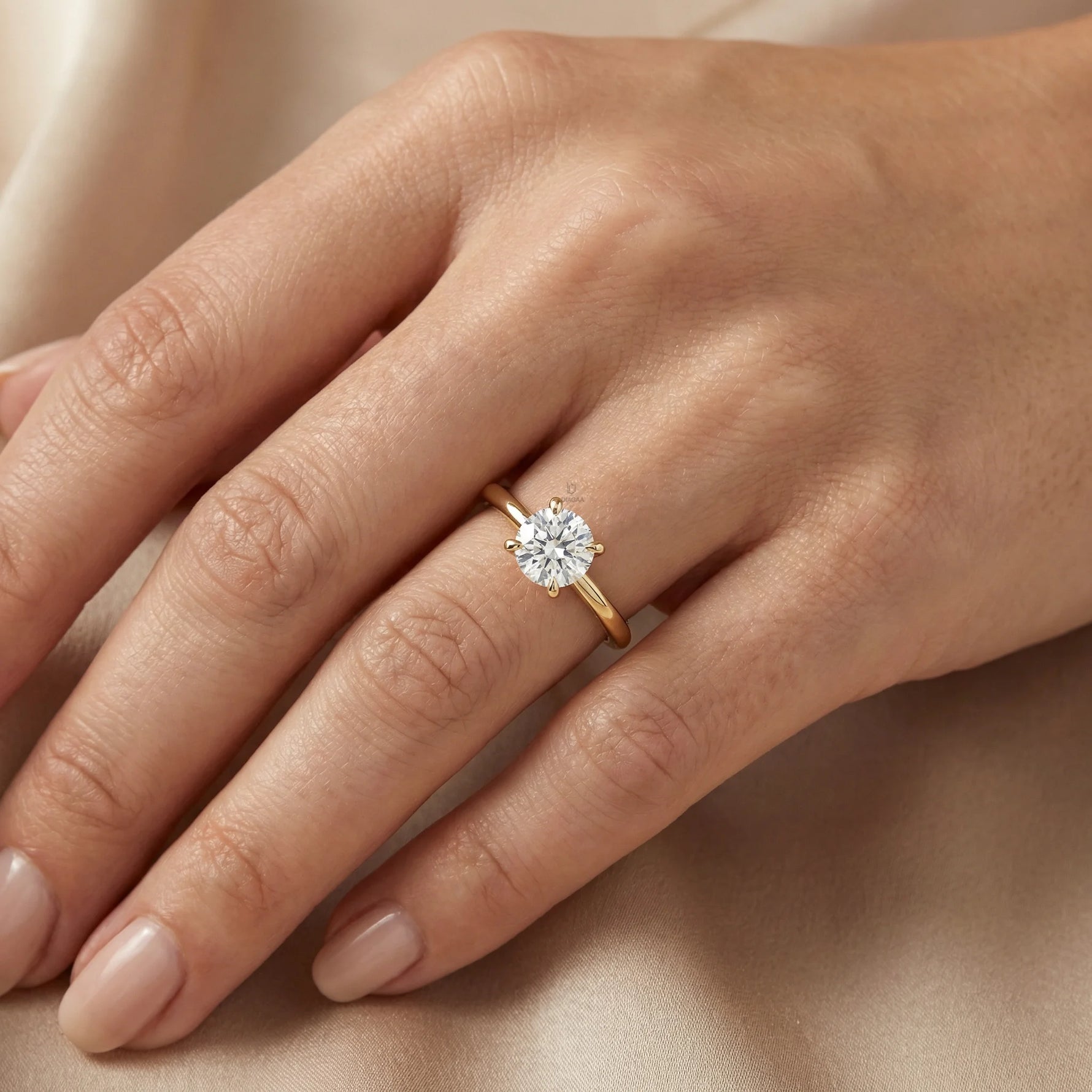 An elegant 14k gold diamond ring showcasing a sparkling round solitaire stone set on a slim polished band, with engagement ring 
