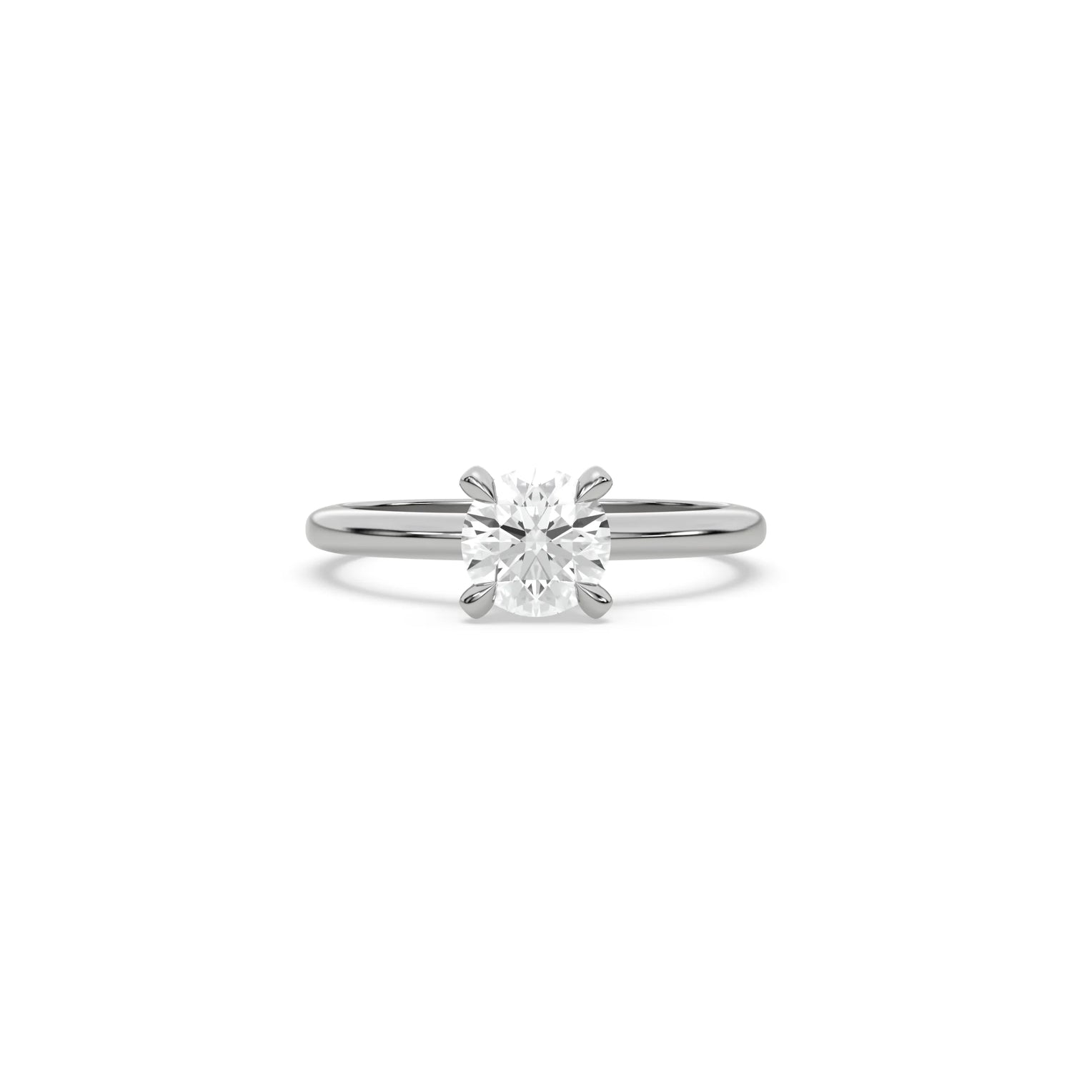 A minimalist white  gold engagement ring with a sparkling round diamond center stone on a slim, polished metal plain band.