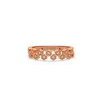 This rose gold ring displayed on front view is made with  round brilliant-cut diamonds, each set individually in a hexagon bezel and arranged in a zig zag pattern