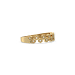 This yellow gold ring displayed on side view is made with  round brilliant-cut diamonds, each set individually in a hexagon bezel and arranged in a zig zag pattern