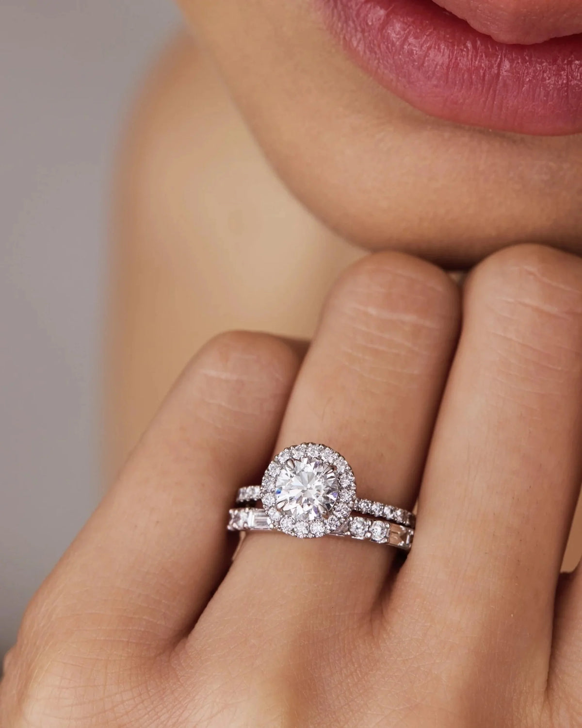 This white gold ring displayed on model is made with a round solitaire diamond set in four-prong setting