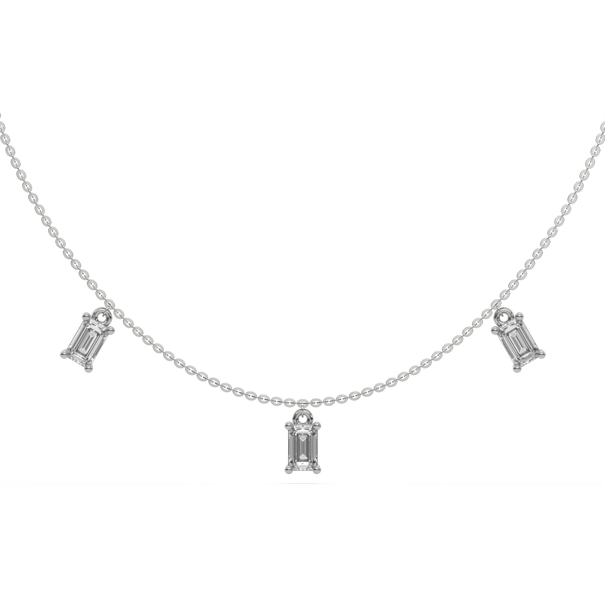 Emerald Dangling Diamond Necklace made with seven emerald cut diamonds each set in a prong setting, distributed evenly along the chain