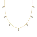 Oval Dangling Diamond Necklace made with seven oval cut diamonds each set in a prong setting, distributed evenly along the chain