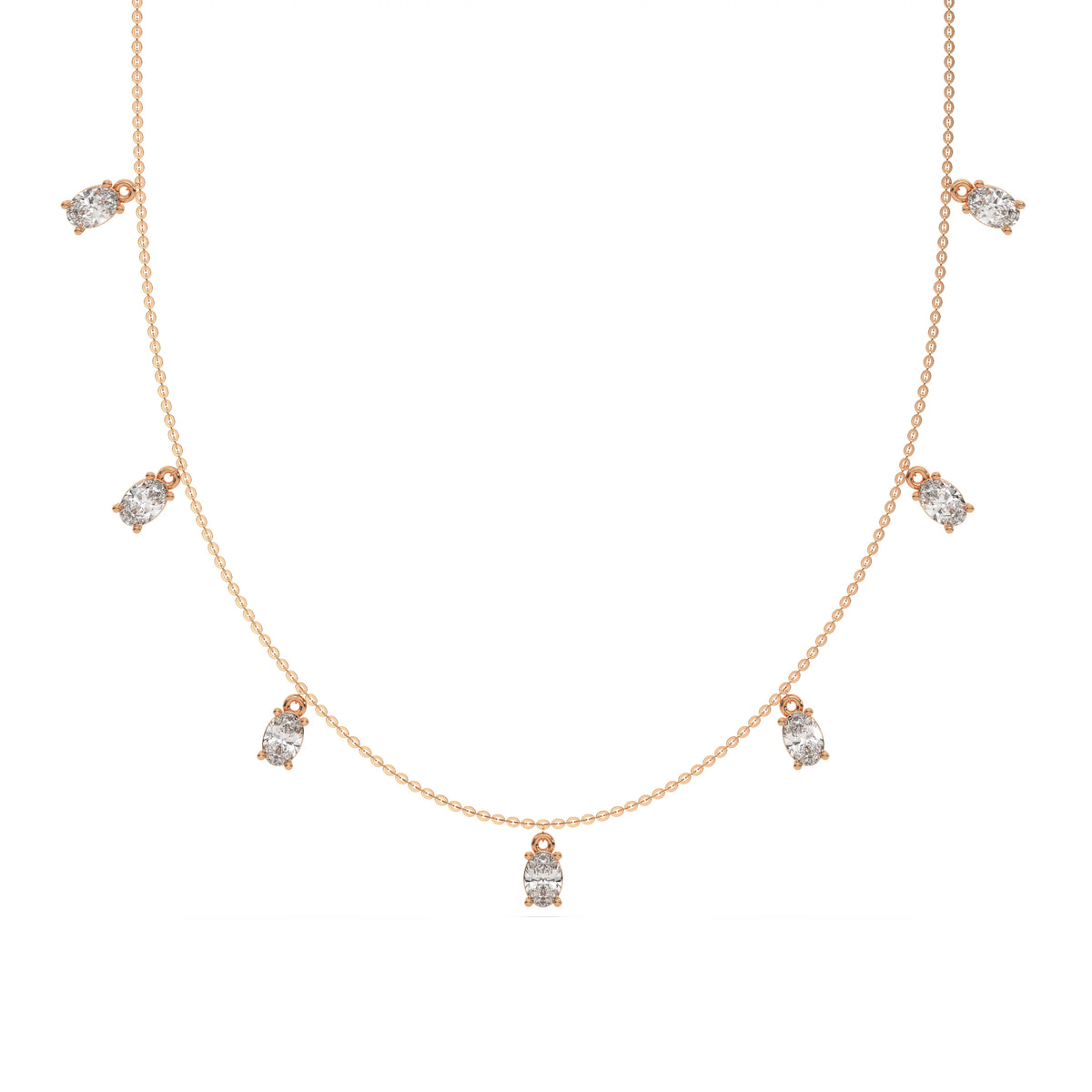 Oval Dangling Diamond Necklace made with seven oval cut diamonds each set in a prong setting, distributed evenly along the chain