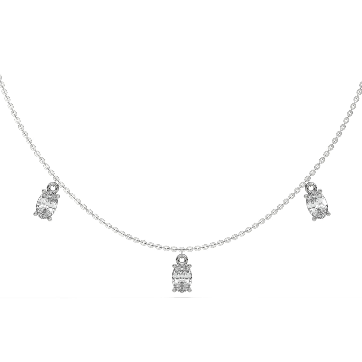 Oval Dangling Diamond Necklace made with seven oval cut diamonds each set in a prong setting, distributed evenly along the chain