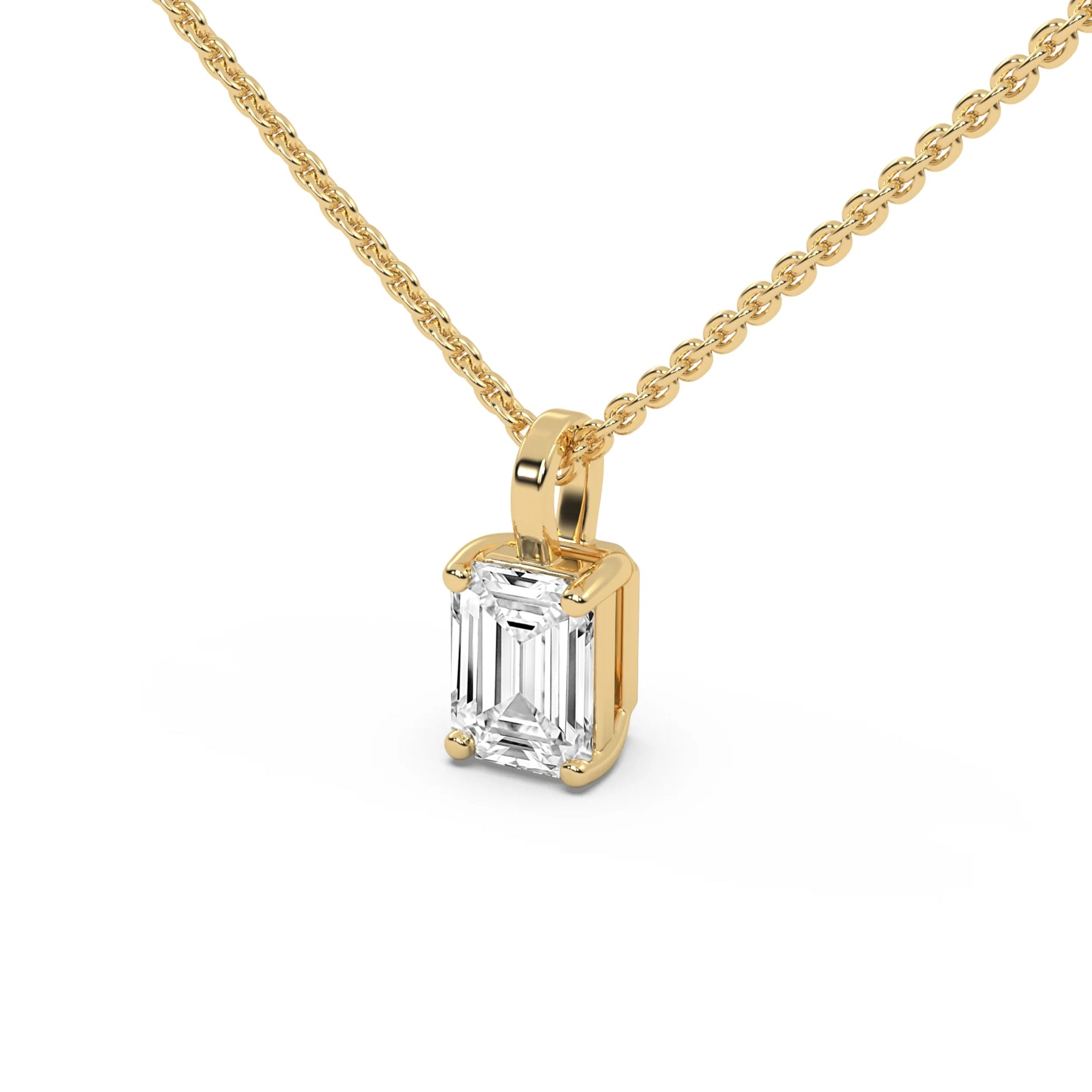 This yellow gold pendant features an emerald-cut diamond set securely in a four-prong setting in side view