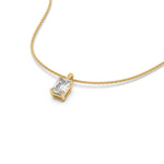 This yellow gold pendant features an emerald-cut diamond set securely in a four-prong setting in 3D view