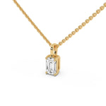 This yellow gold pendant features an emerald-cut diamond set securely in a four-prong setting in side view