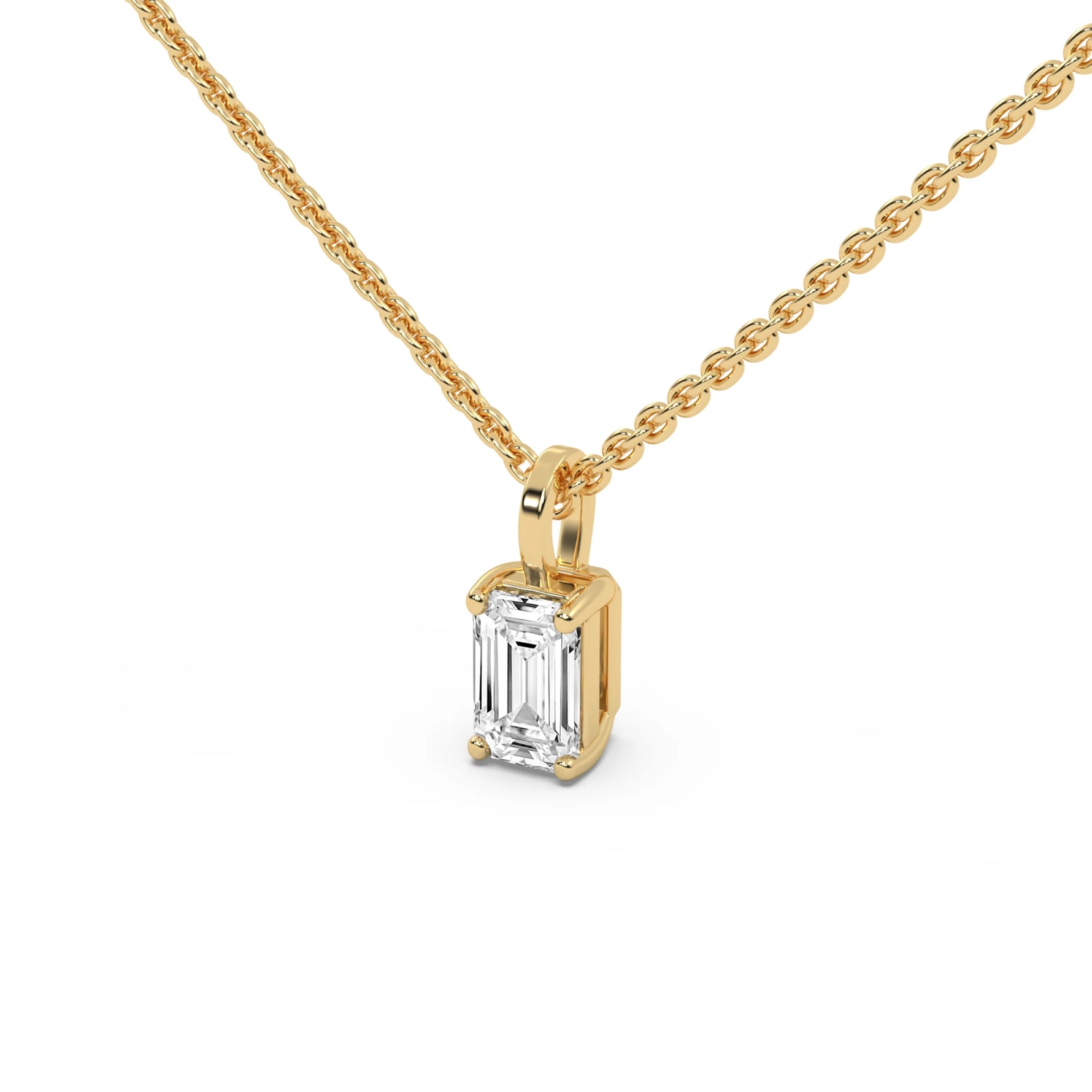 This yellow gold pendant features an emerald-cut diamond set securely in a four-prong setting in side view