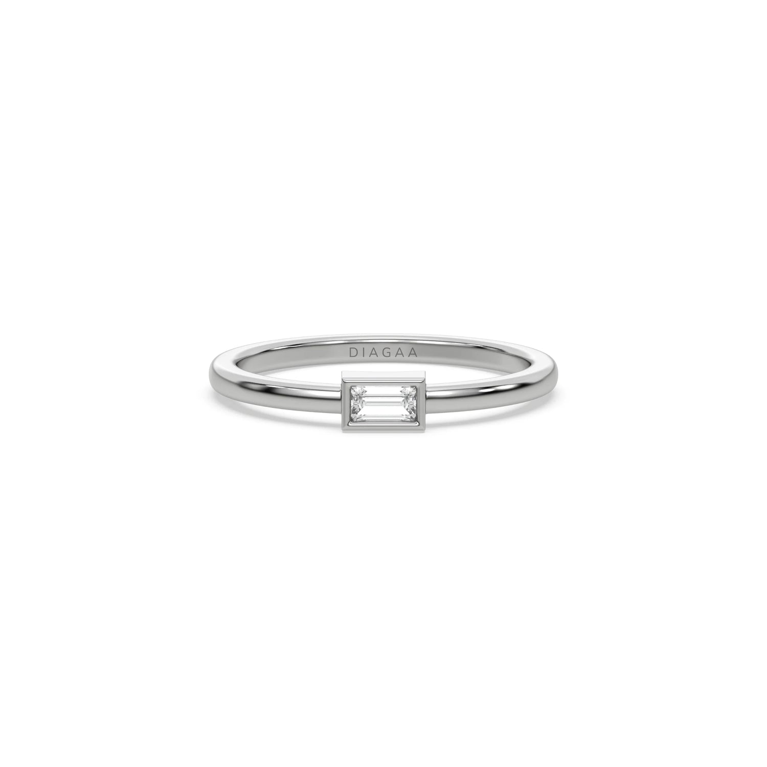white gold stacking ring featuring a horizontal baguette cut diamond in a sleek bezel setting wedding ring.