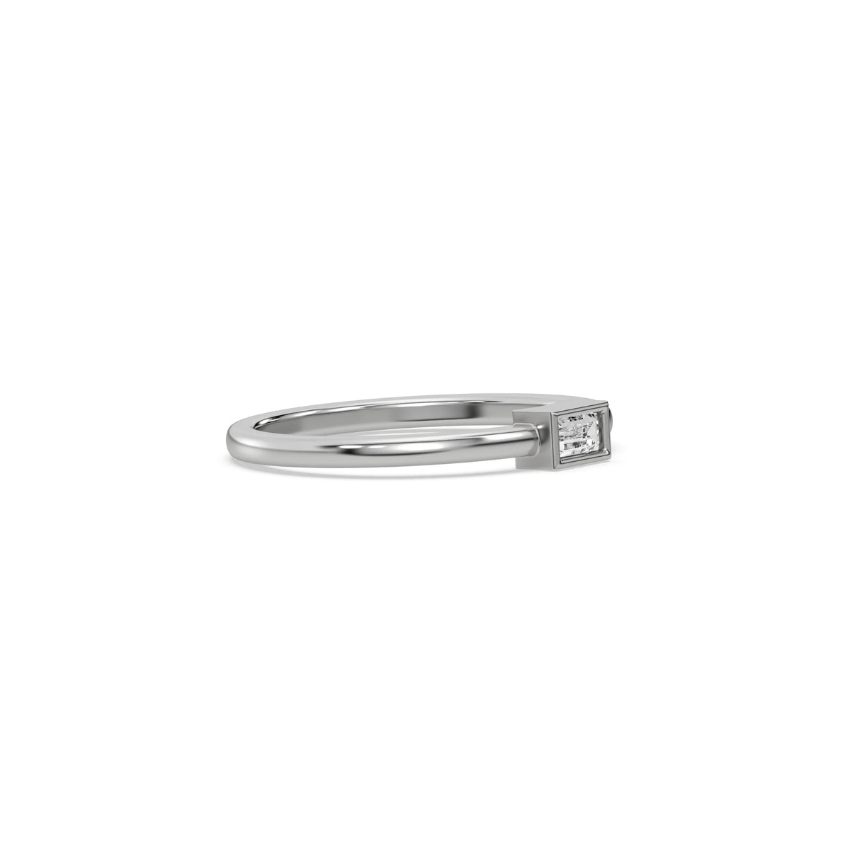 This white gold ring displayed on side view is made with baguette solitaire diamond in bezel setting