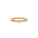 This rose gold ring displayed on front view is made with brilliant round diamond set in bezel setting