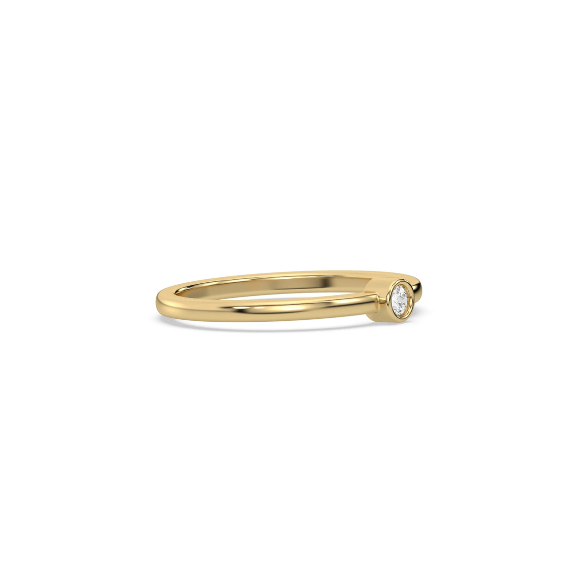 This yellow gold ring displayed on side view is made with brilliant round diamond set in bezel setting