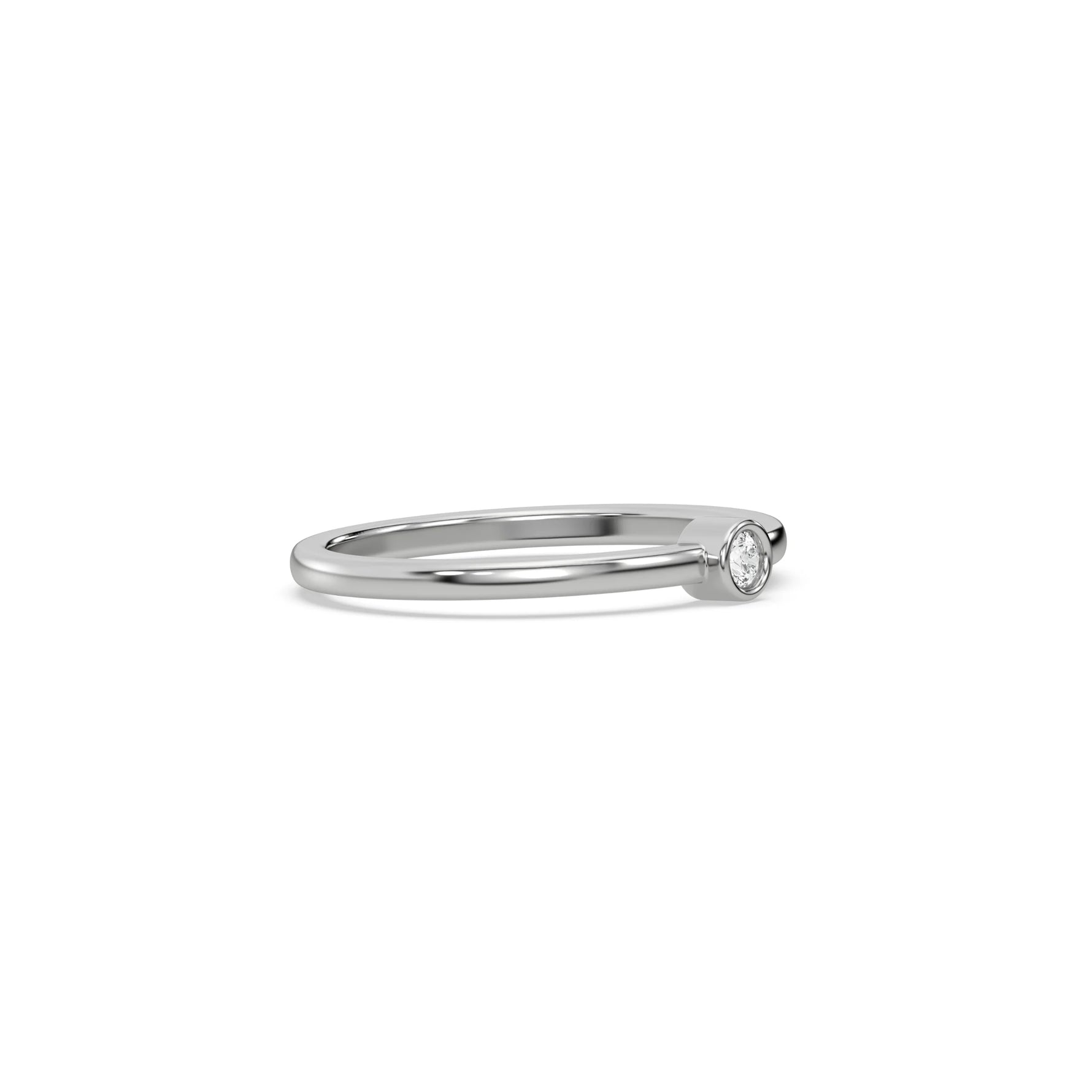 This white gold ring displayed on side view is made with brilliant round diamond set in bezel setting