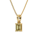 This yellow gold Fancy Yellow Emerald Solitaire Diamond Necklace made with an fancy yellow emerald cut diamond in a four prong setting with adjustable chain in side view