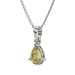 This white gold Fancy Yellow Pear Solitaire Diamond Necklace made with a fancy yellow pear cut diamond in a four prong setting with adjustable chain in side view