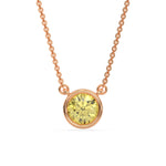 This rose gold Fancy Yellow Round Solitaire Diamond Necklace made with a fancy yellow round brilliant-cut diamond in bezel setting with adjustable chain in top view