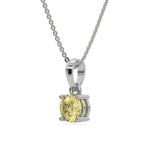 This white gold Fancy Yellow Round Solitaire Diamond Necklace made with fancy yellow round brilliant-cut diamond in a four prong setting with adjustable chain in side view