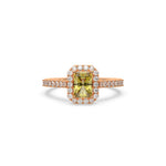 This rose gold ring displayed in front view is made with a radiant solitaire diamond set in four-prong setting