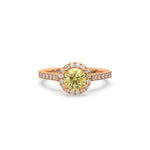 This rose gold ring displayed in front view is made with a round solitaire diamond set in four-prong setting