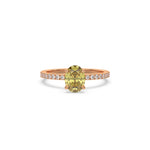 This rose gold ring displayed in front view is made with a oval solitaire diamond set in four-prong setting