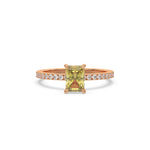 This rose gold ring displayed in front view is made with a radiant solitaire diamond set in four-prong setting