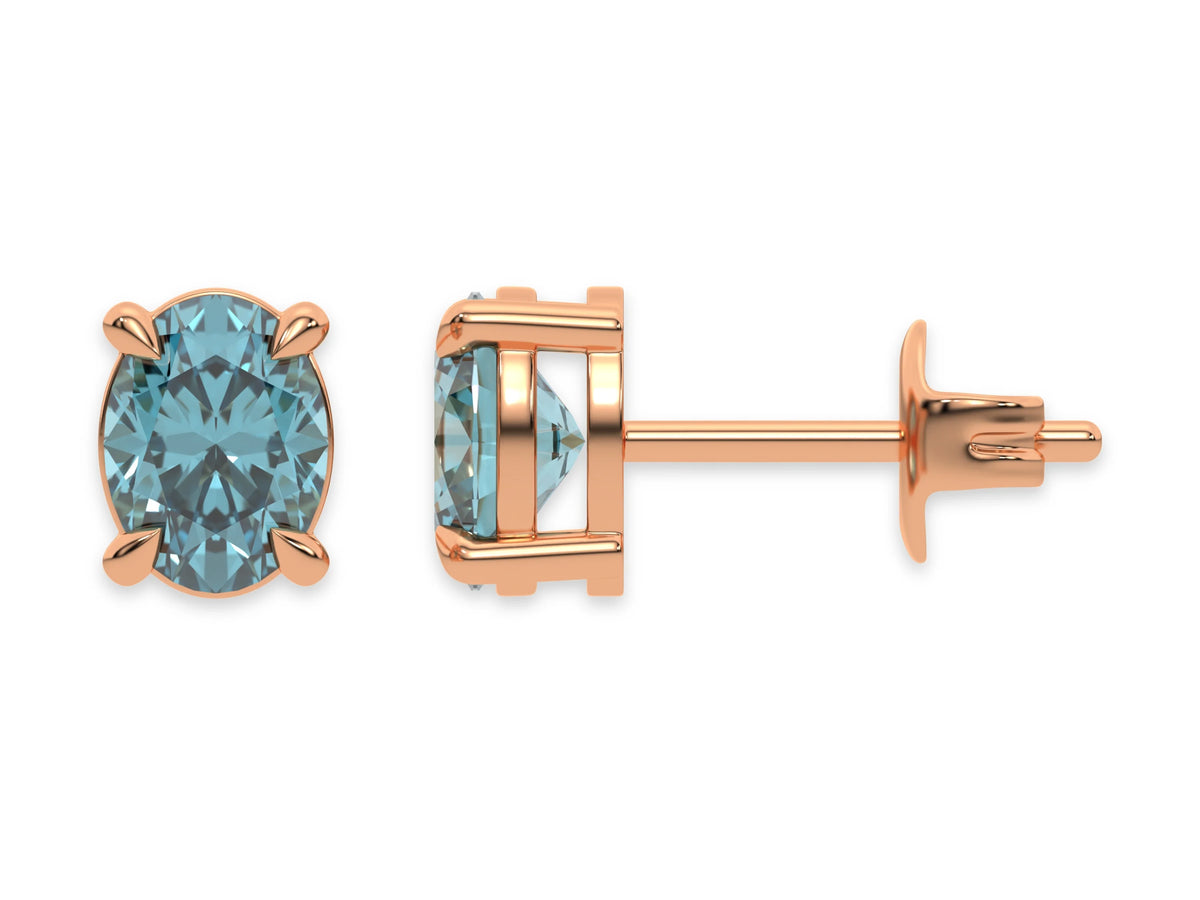 18k rose gold oval diamond stud earrings made with a fancy blue oval cut diamond set in a four prong setting