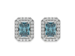 14k white gold Radiant Diamond Halo Earrings made with a fancy blue radiant cut solitaire diamond set in a four prong setting.