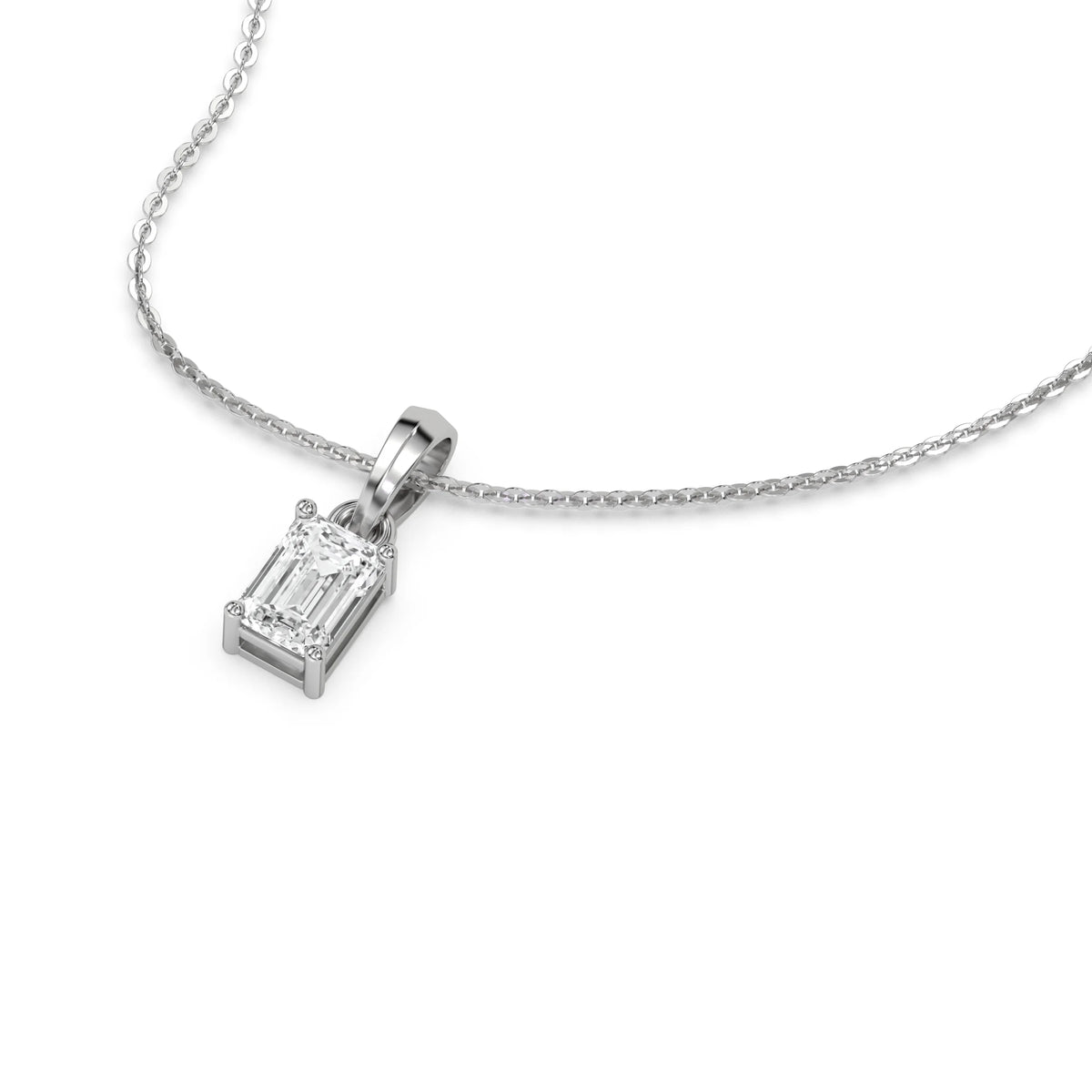 Angled perspective of an emerald diamond necklace in white gold featuring a prong-set solitaire pendant.