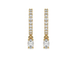 14k yellow gold dangling oval diamond hoop earrings with round brilliant cut diamonds in prong setting in hoop.