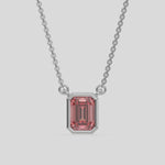  Fancy Pink Emerald Solitaire Diamond Necklace made with an fancy Pink emerald cut diamond in bezel setting with adjustable chain 