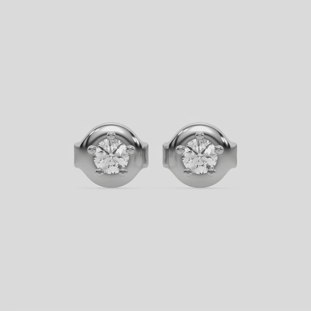 This video features a white gold Classic Round Solitaire Diamond Earrings made with round brilliant-cut diamond and set in a five prong setting