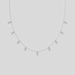 This yellow gold Round Dangling Diamond Necklace made with nine round brilliant-cut diamond set in a prong setting, distributed evenly along the chain