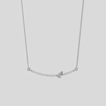 Curved Bar Diamond Necklace made with round brilliant-cut diamond in prong setting with a pear solitaire on top set at an angle with adjustable chain