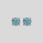 This video features a white gold Classic Round Diamond Studs made with fancy blue round brilliant-cut diamonds set in a four prong setting