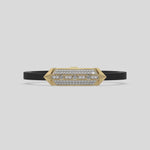 This video features a yellow gold  infinity diamond rubber bracelet, a striking statement piece featuring two diamond rows on each end and a central bar line made with gold motifs and diamonds, all set in a prong setting 