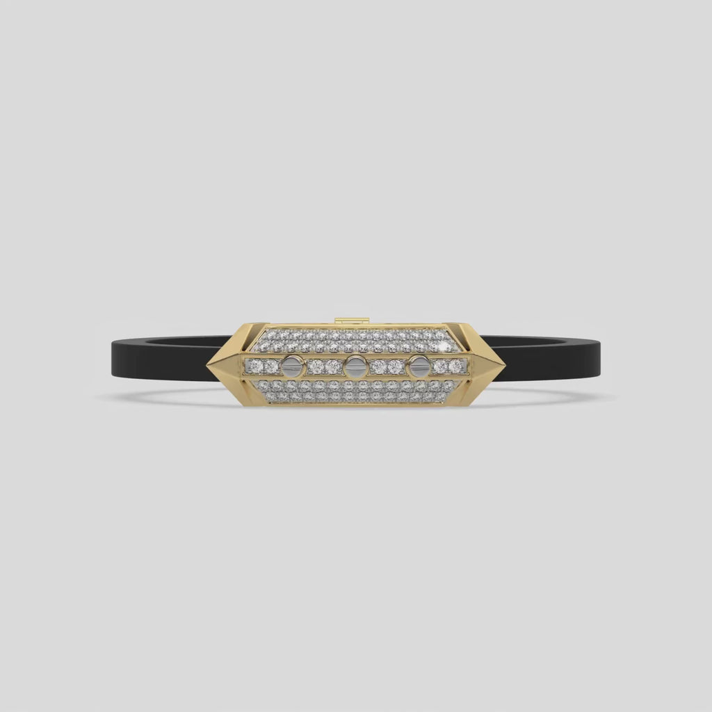 This video features a yellow gold  infinity diamond rubber bracelet, a striking statement piece featuring two diamond rows on each end and a central bar line made with gold motifs and diamonds, all set in a prong setting 