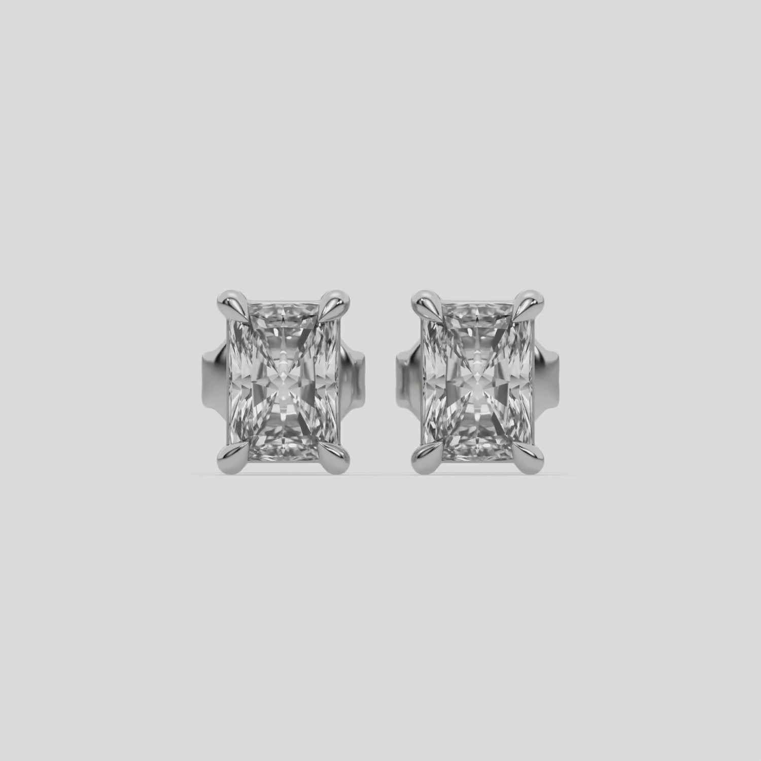 This video features a white gold Classic Radiant Diamond Earrings made with a radiant-cut diamonds set in a four prong setting